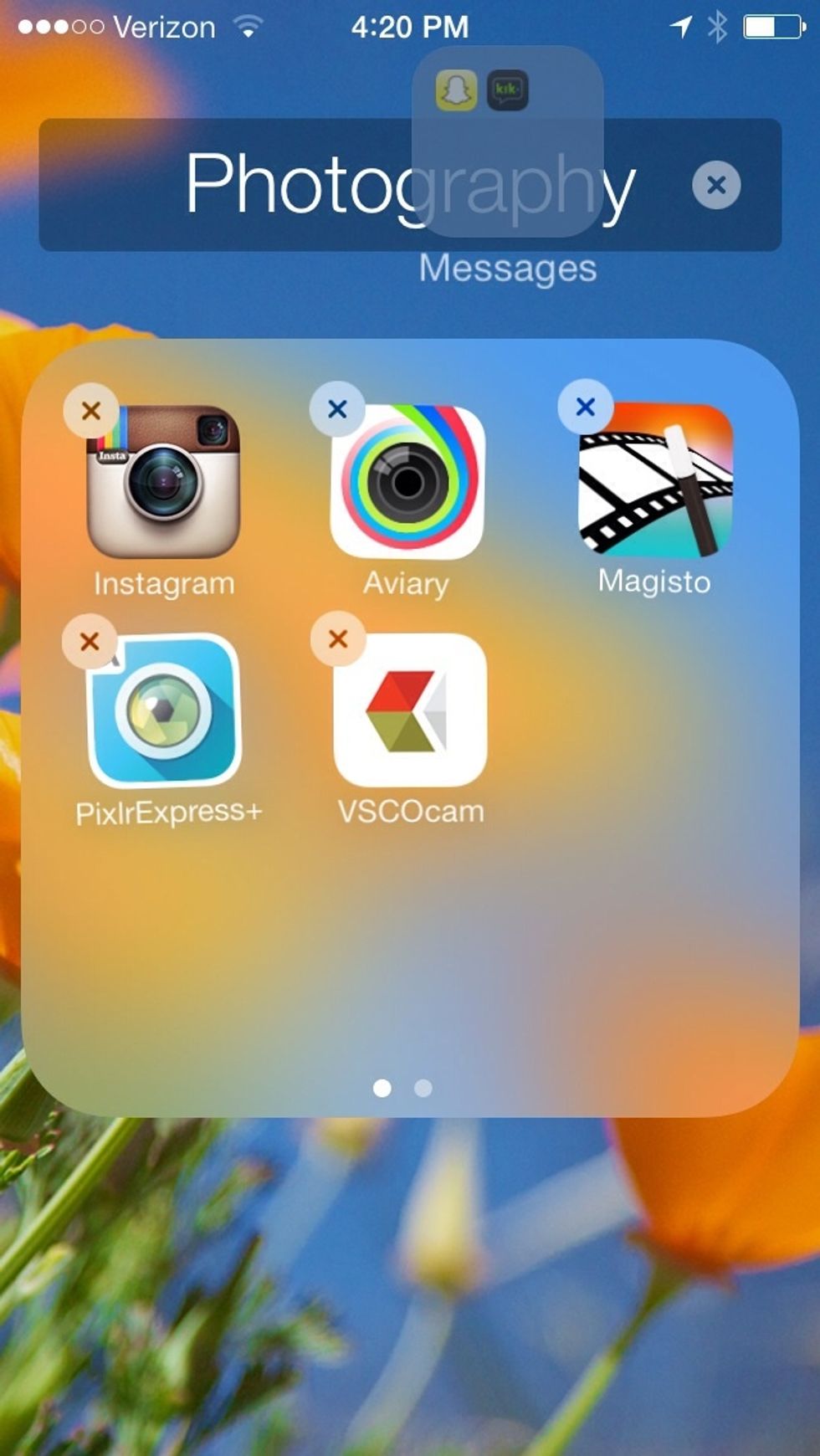 Tap on the folder you want to put the folder in. The gray folder should be on the side of the folder you want to put it in.