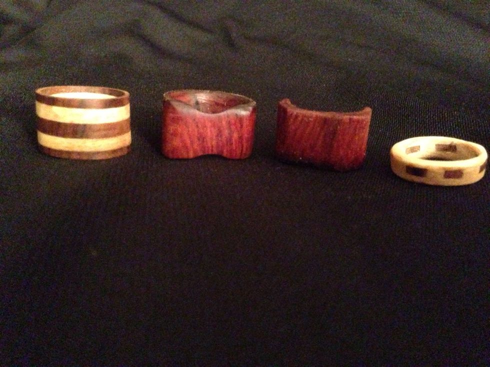 Tap on the picture to view my first four rings. The two rings on the end or laminated (glued) and the two in the middle are exotic wood from one solid piece. Check out my other woodworking projects.