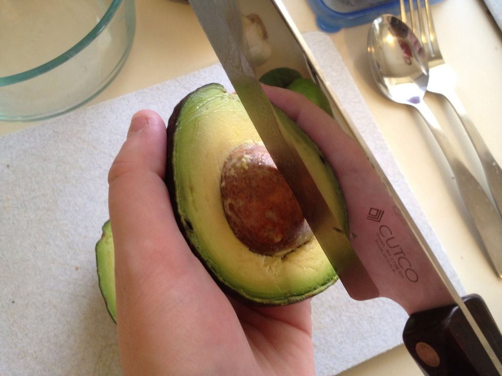 Tap seed with knife and twist.
