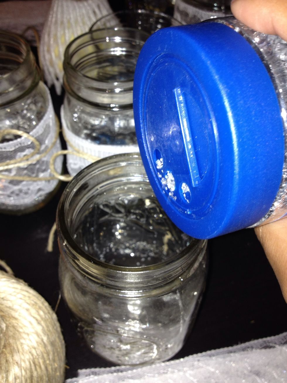 Tap some glitter into the mason jar and roll the jar around to get the jar even with glitter