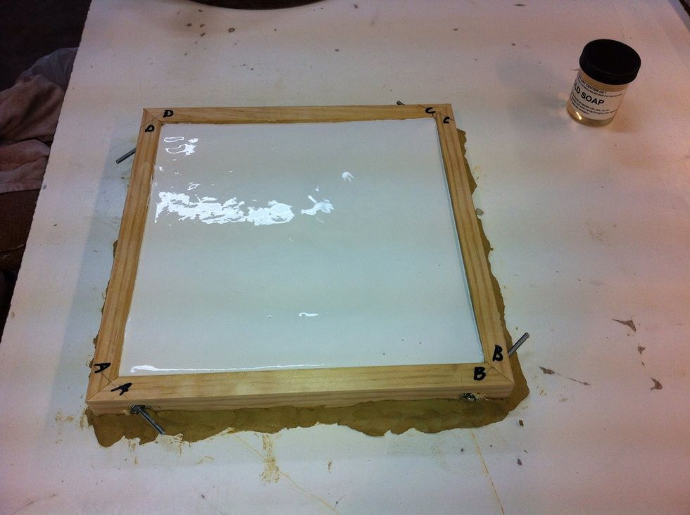 Tap table with rubber mallet to bring any air bubbles to surface