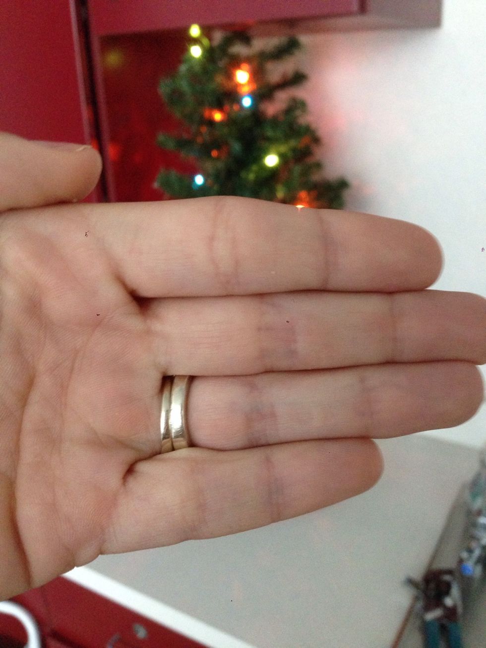 Tap the screen on your iPhone so that the camera focuses on your hand causing everything in the background to get blurry.