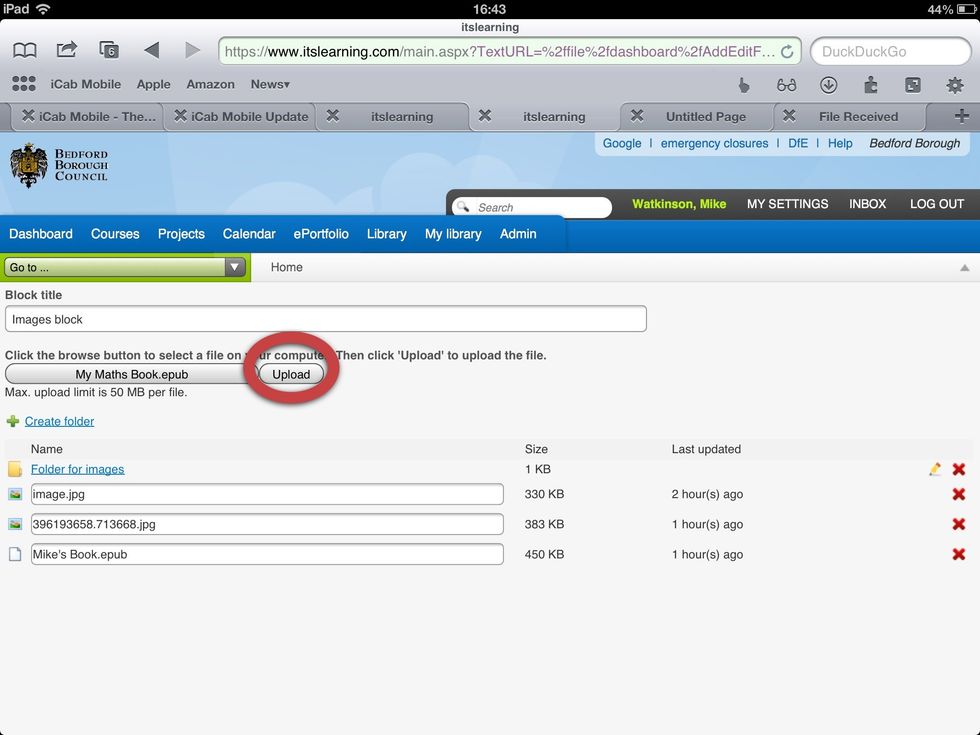 Tap the 'Upload' button (or equivalent)