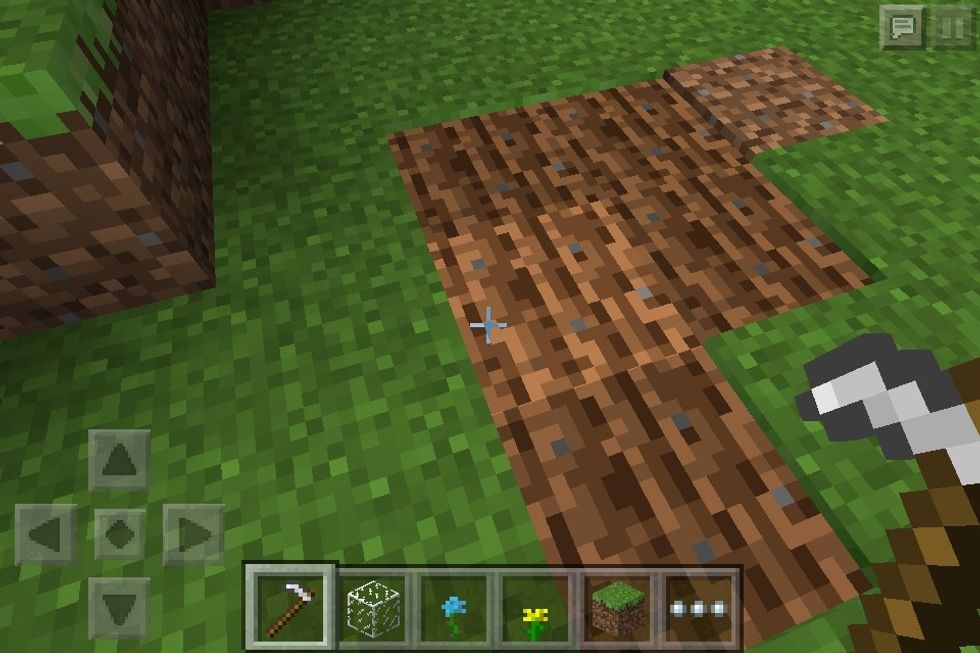 Tap where you want to put your garden with iron hoe