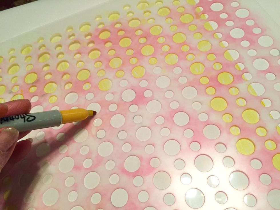 tape a sheet of Clear Shrink Film down to work surface. place Beaded Curtain stencil on top of sheet and tape down to secure. fill in circle designs using Yellow Sharpie.