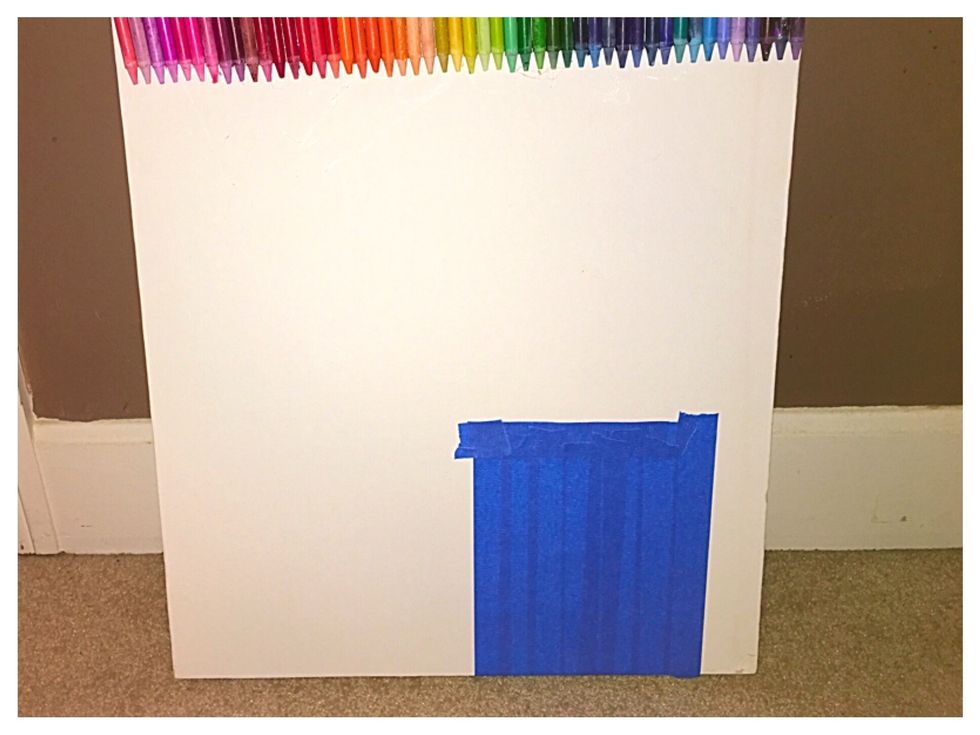 Tape a square on the canvas in the area you want to draw on at the end. This will prevent the melted crayon from getting on that area.