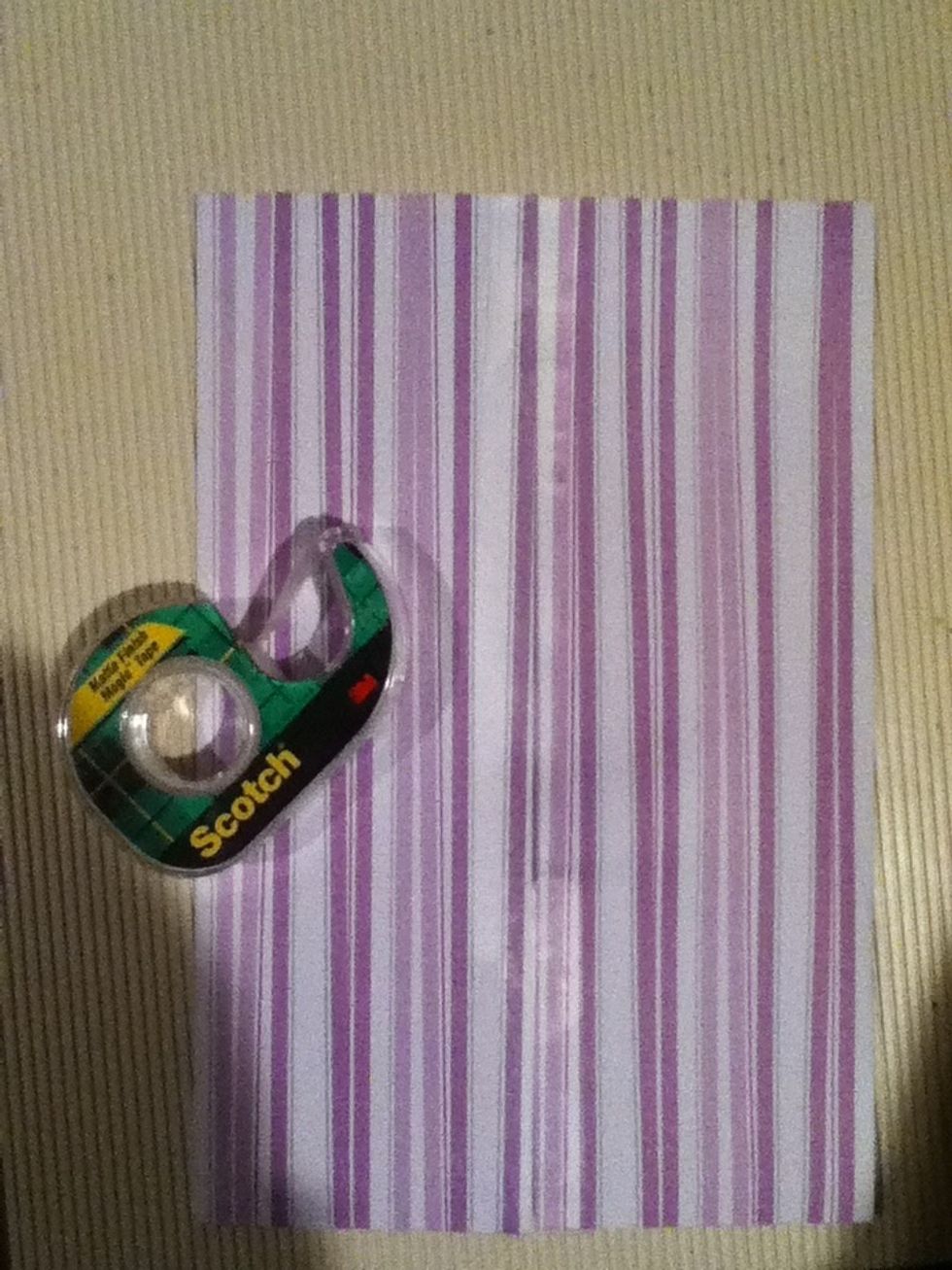 Tape along the seam so that your paper lies flat and is connected.