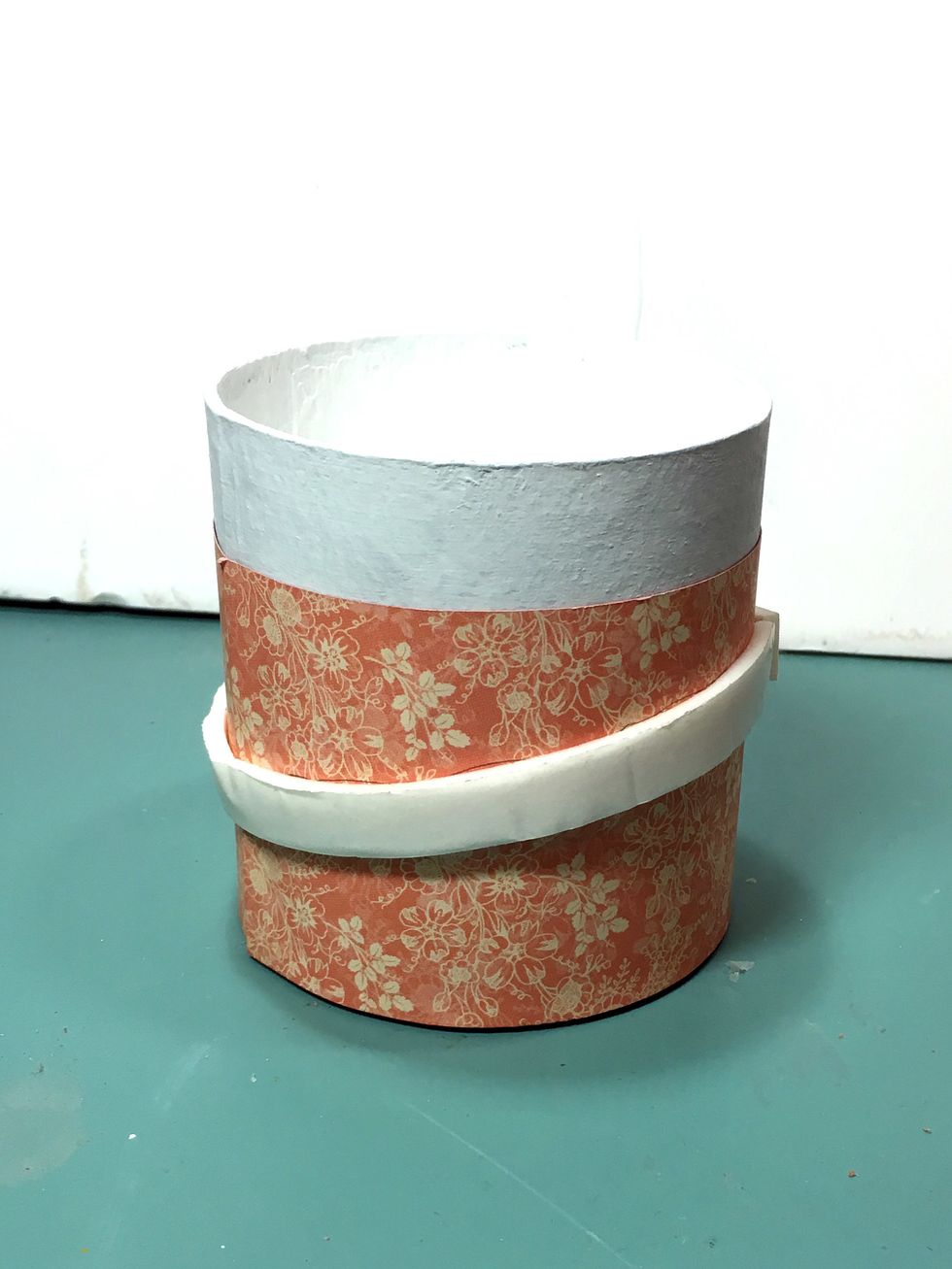 Tape around the box where you marked the brim placement with dimensional foam tape.