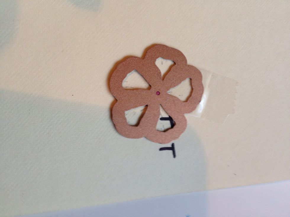 Tape die to a piece of card stock. My stamp was very difficult to match so I put a letter on the cut out and the base paper so I would know which way to orient it (this was key to my success)