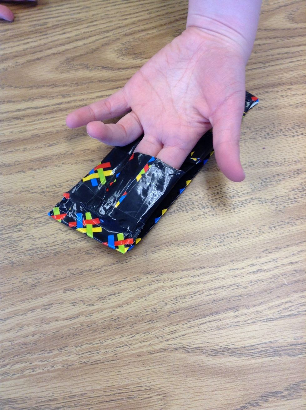 Tape down the top, bottom, and right side instead. Make sure it's on the opposite side of the other pocket.