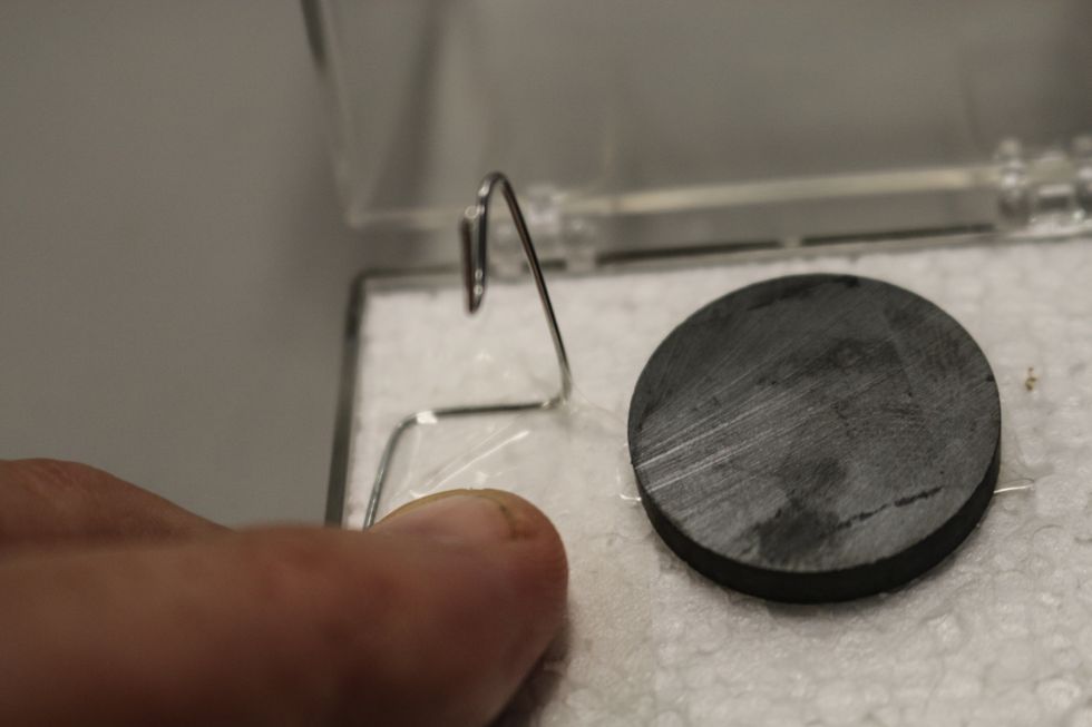 Tape it down. Press the tape so the wire does not move.