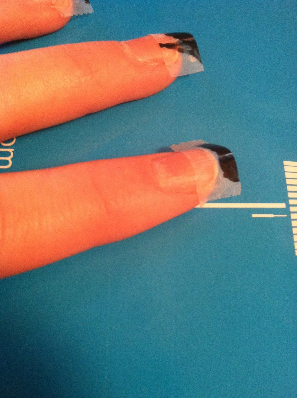 Tape off the top 1/3 of your nails.