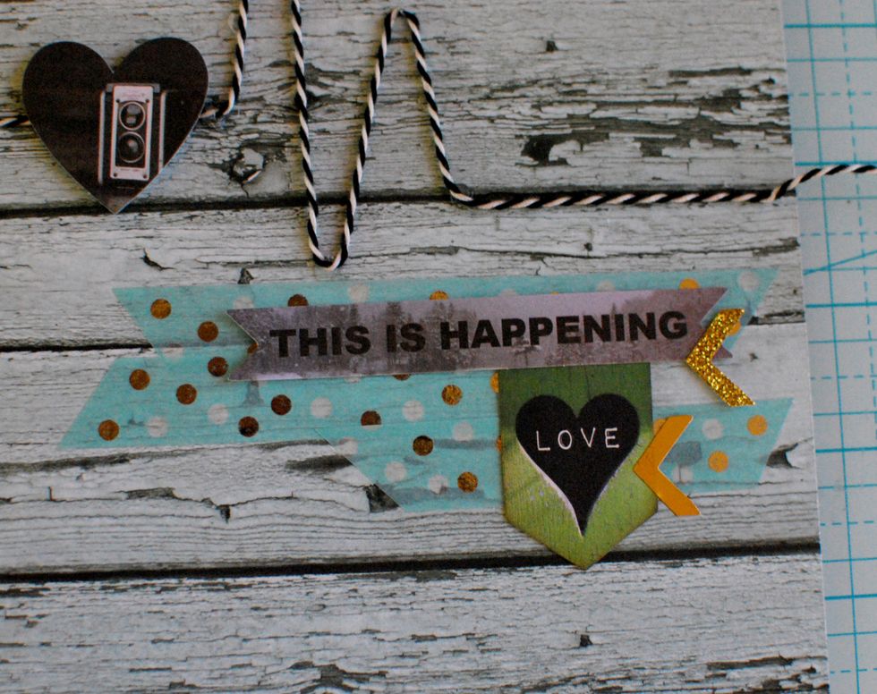 Tape random pieces of Foil Washi Tape under the bakers twine on the right side. Secure \u2018This is Happening\u2019 Noteworthy cut out on top, and the Love banner below. Add a few Foil Chevron Stickers.