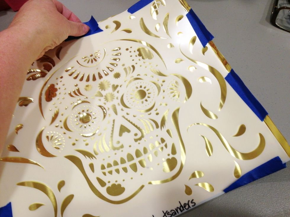 tape stencil to metal using blue painters tape. tape ALL edges to avoid getting cut accidentally by sharp edges of the metal.