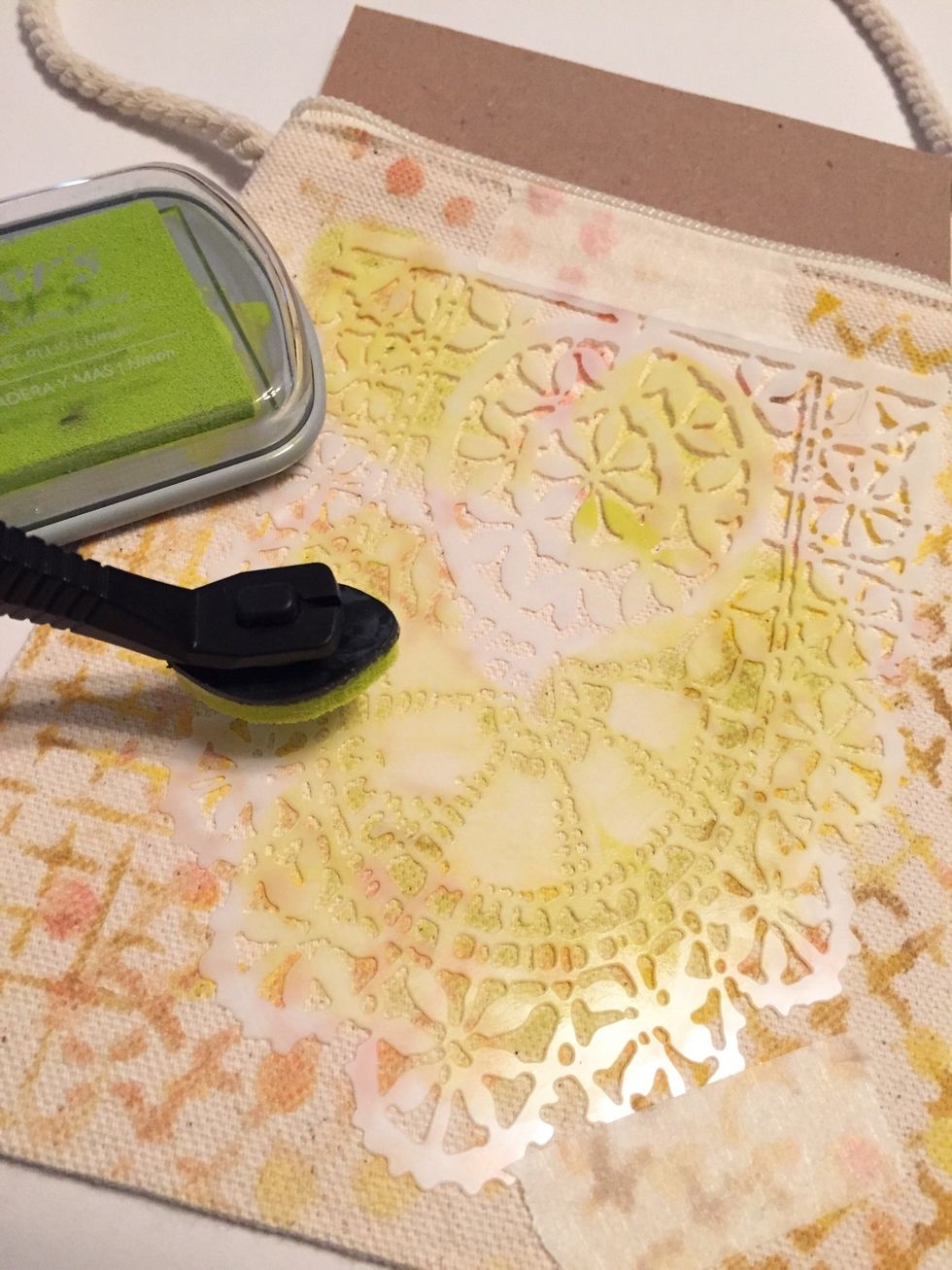tape Tatting stencil at center of bag and begin inking with Limon Ink in areas of the design. you will have to ink the outer edges of the stencil as well as the interior.