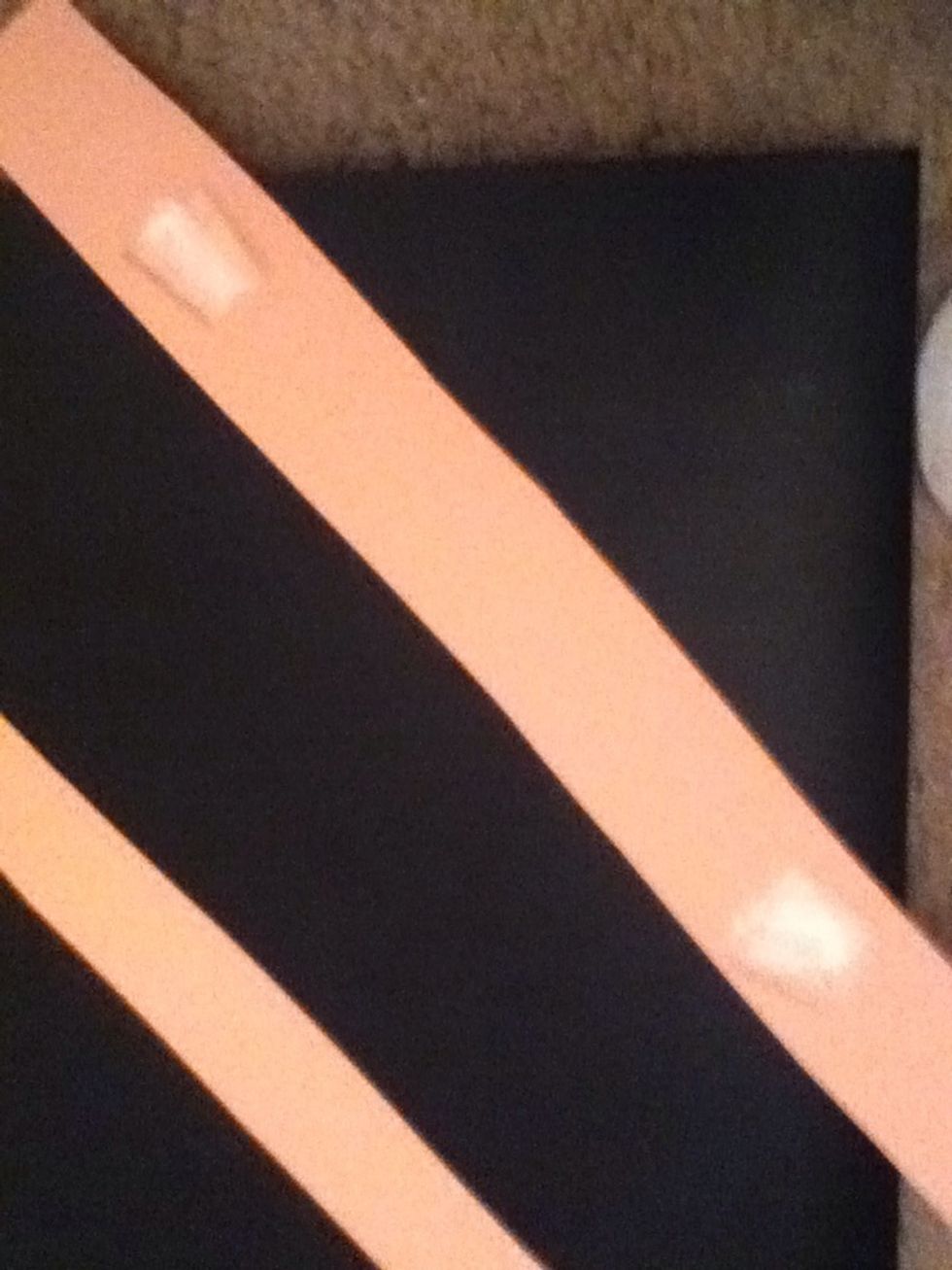 Tape the far ends of the strip (tape the middle strips together before this step)