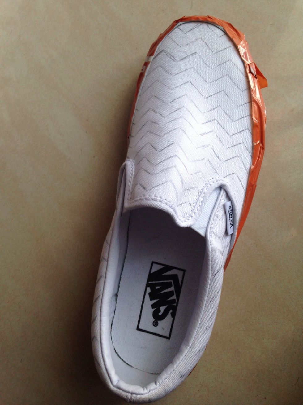 Tape the sole such that you don't get any paint on it.