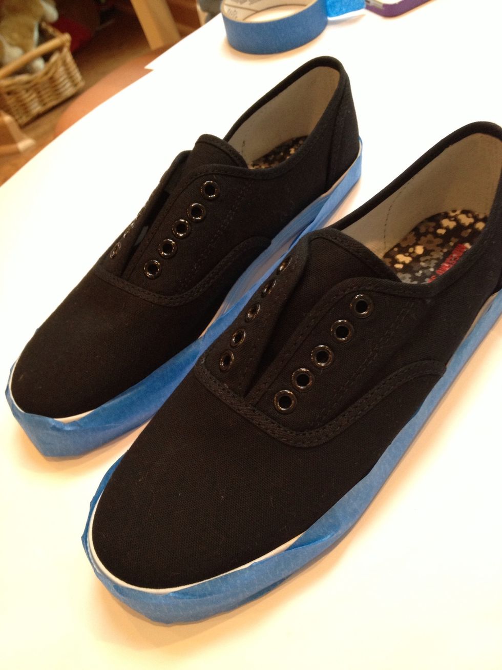 Tape the soles of your shoes to avoid paint spreading onto them