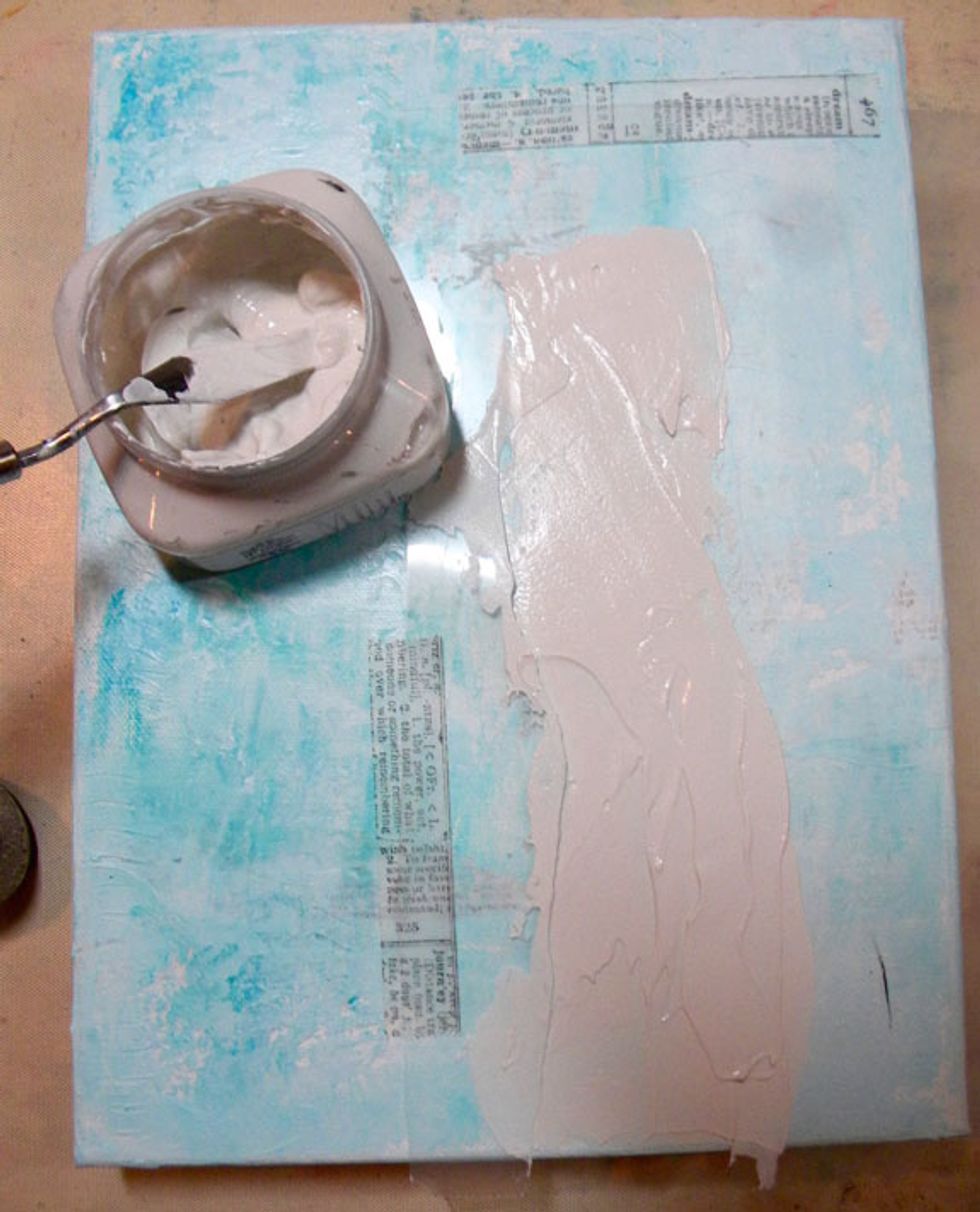 Tape the stencil down onto the canvas using low tack tape, like washi. Remember that the focal point is best if it is not smack in the middle of the canvas. So I offset it a bit to the right.
