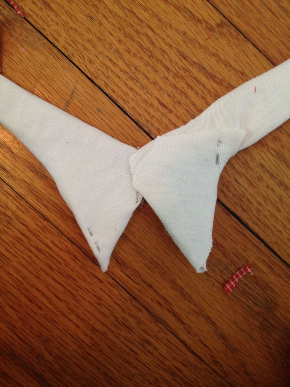 Tape the two white shapes together like this, put the tape on the back.