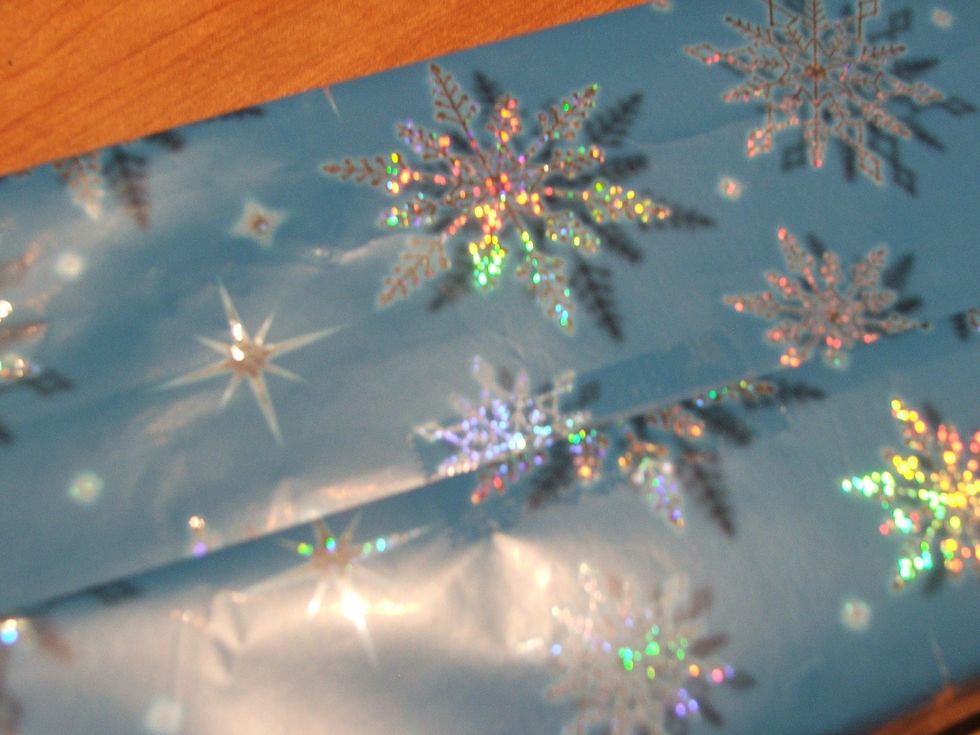 Tape the Wrapping Paper to the sides of the box.