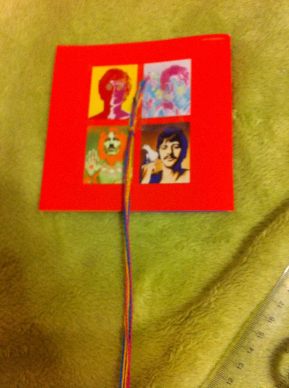 Tape to a solid surface (I'm using a Beatles cd cover because im too lazy to go to a table)