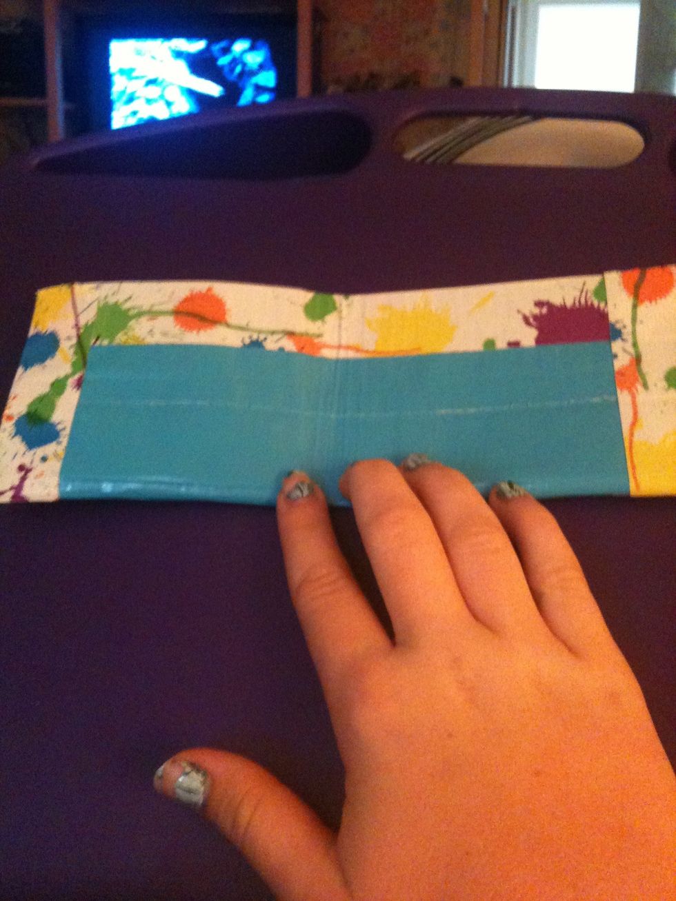 Tape together,to make a pocket, on the short edges.