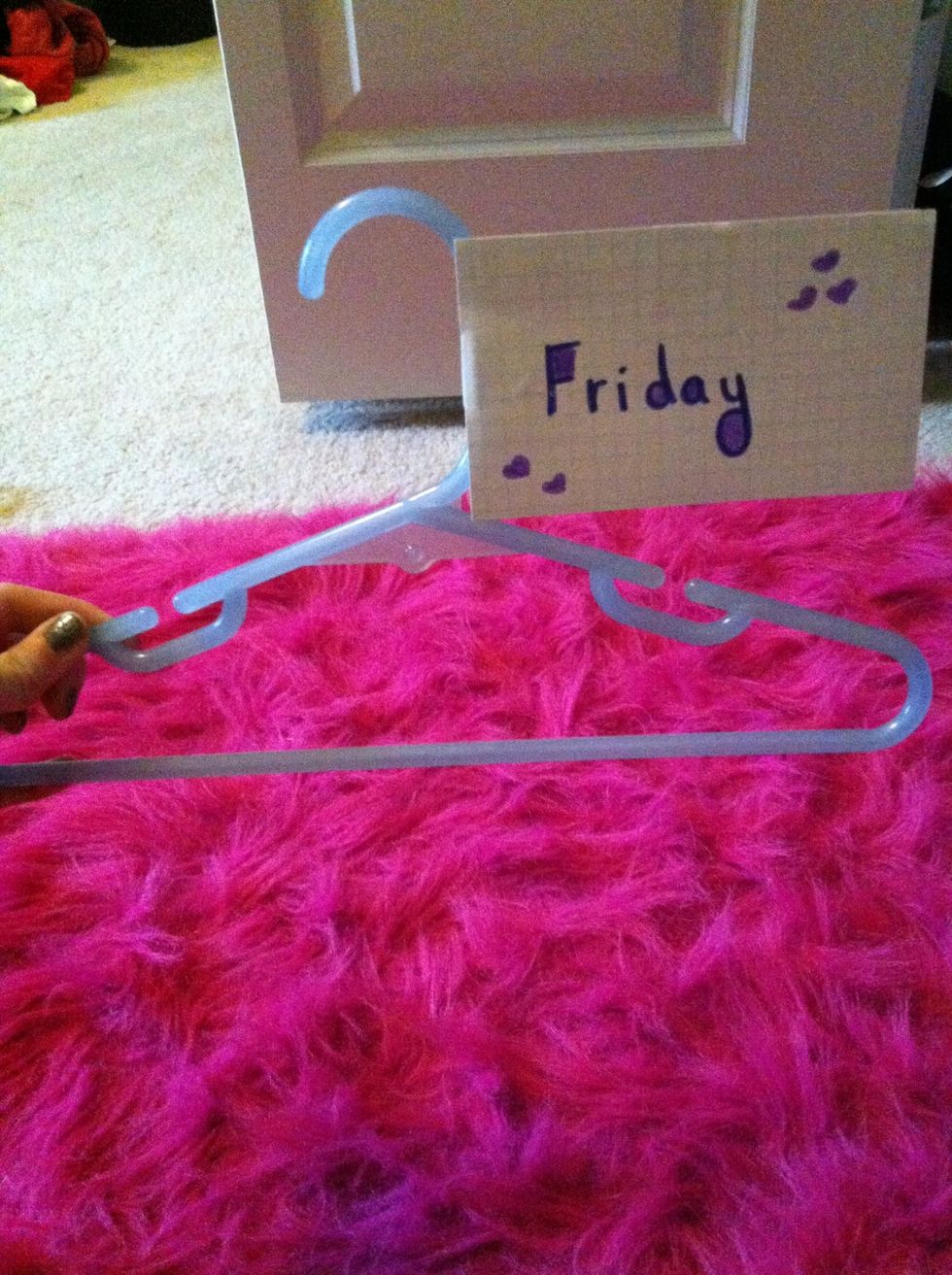 Tape your card to the "neck" of the hanger.