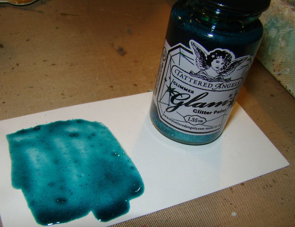 Tattered Angels Glitter Glam is gorgeous !!! Vivid, glaze-like, and is so versatile. I used Caspian Sea and brushed a bit on top of the butterfly wings.