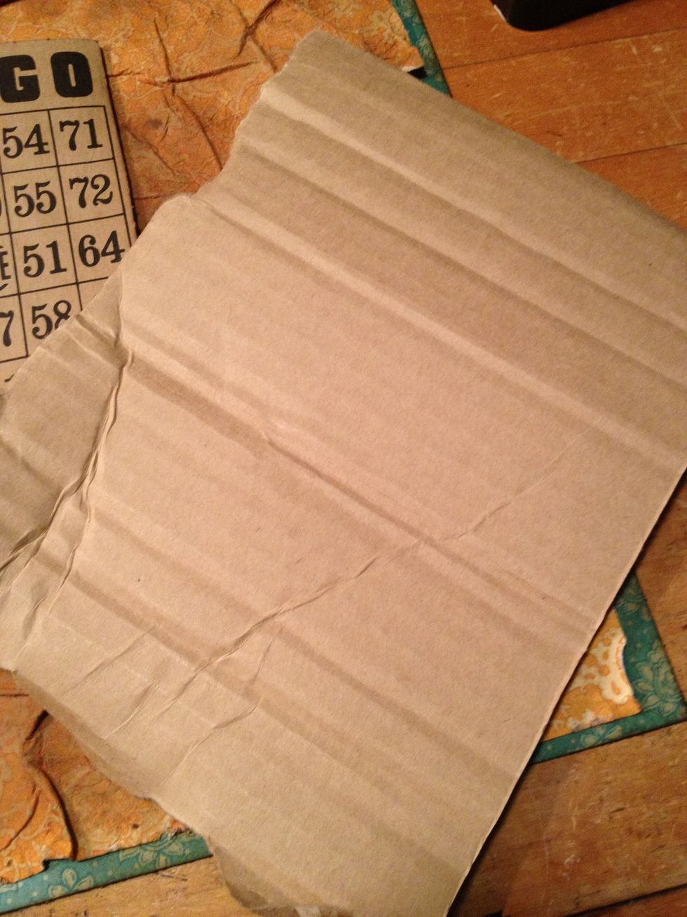 tear a piece of corrugated paper (box scrap) a bit larger than photo you will be placing on layout. I used a 4 x 6 photo so I tore my piece to about 5 x 7.