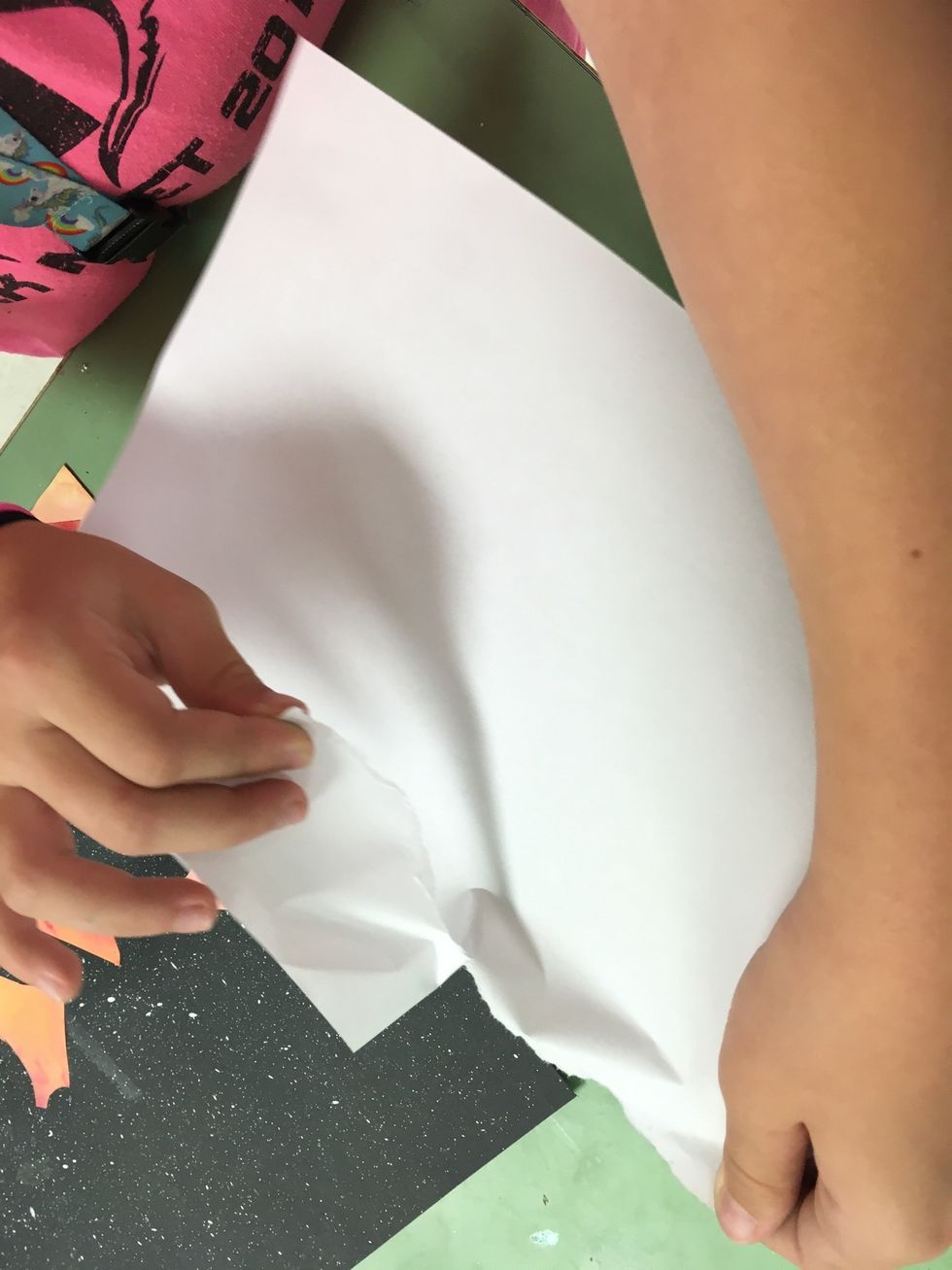 Tear a piece of scrap paper. We will need the edge. It can even be a magazine or something like that.