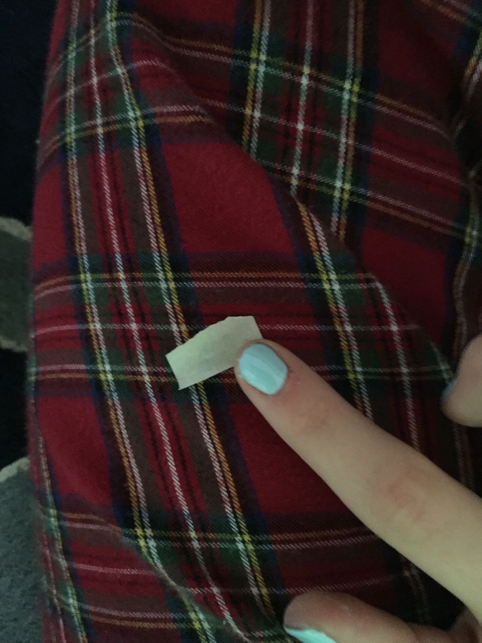 Tear a piece of tape and dab it on your clothing to reduce the stickiness! (And not smudge the base coat) \ud83d\udc83