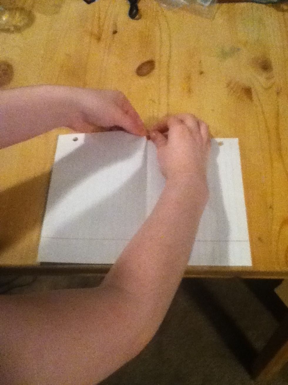 Tear a small rip on one side.