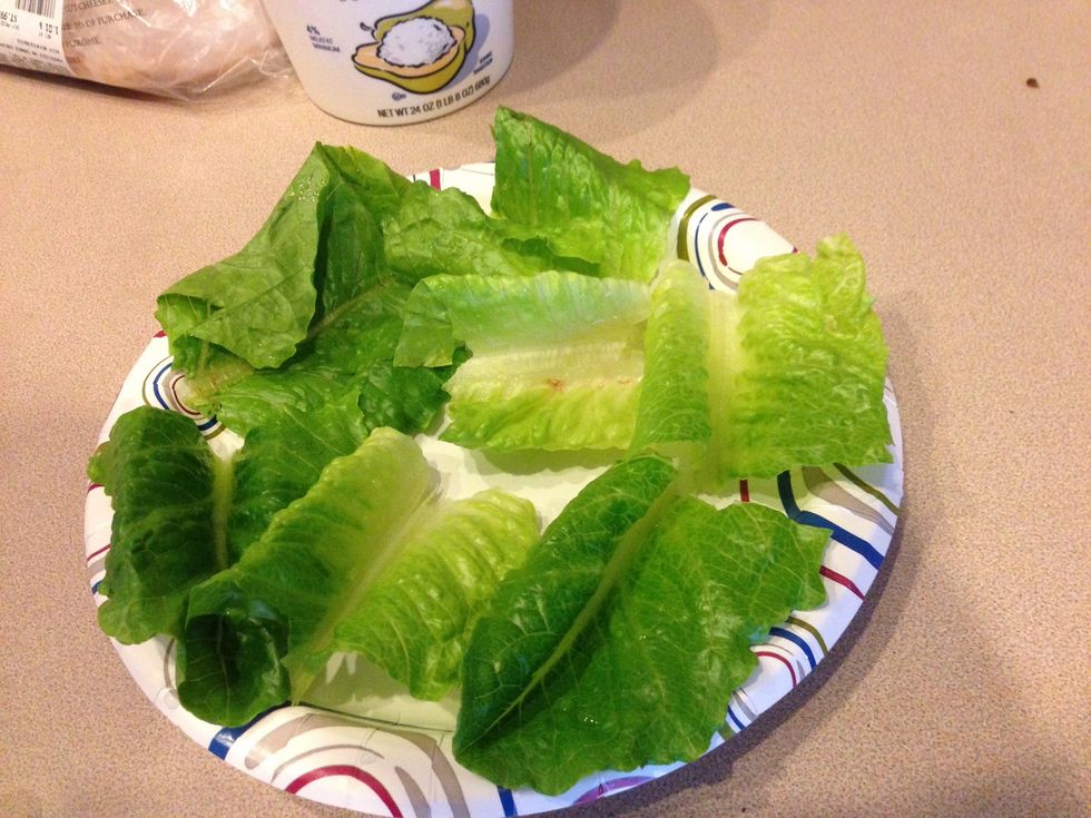 Tear approximately 3 or 4 inch portions off of the romaine leaf. Place them on a plate or tray, depending on how many you're making.