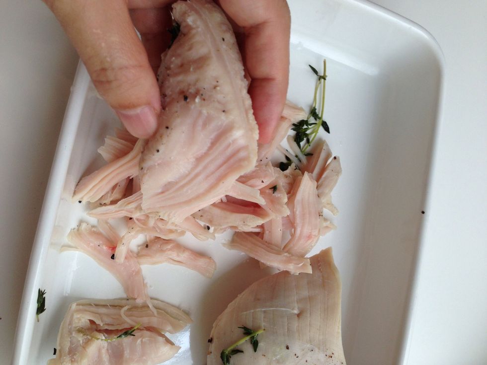 Tear it by hand. It is not too hot to touch.