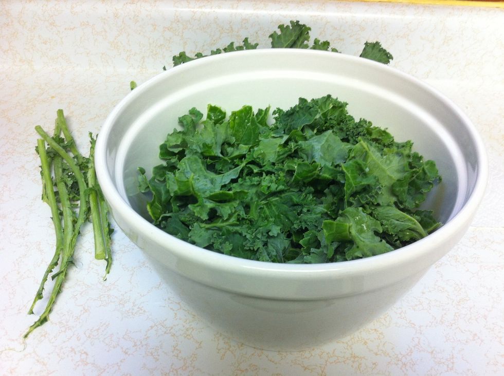 Tear kale into bite-sized pieces and place it into a large bowl.