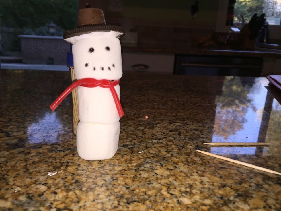 - Tear off a piece of a pull apart Twizzler long enough to wrap around a marshmallow with ends. - Wrap it around between marshmallows 1 & 2. - Tie at the ends and pinch to keep them together.