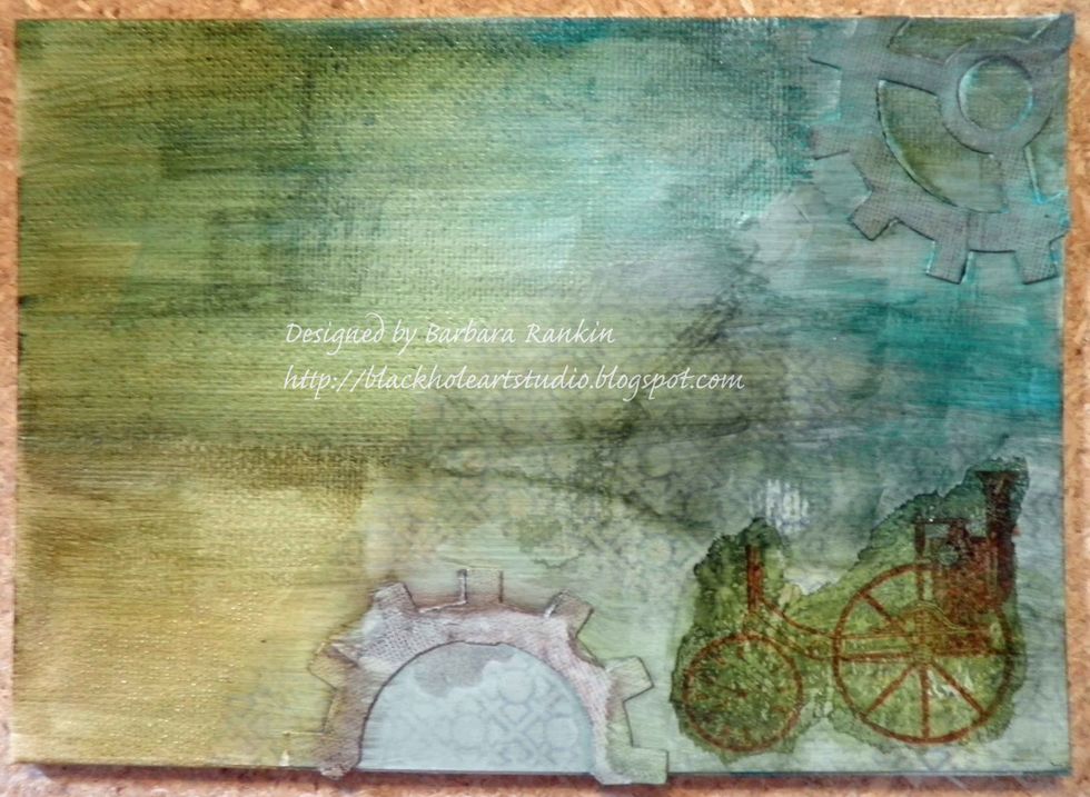 Tear out steam engine image and adhere to canvas with matte medium. The re-inkers are reacting with the matte medium and coloring the deli wrap as I apply it.