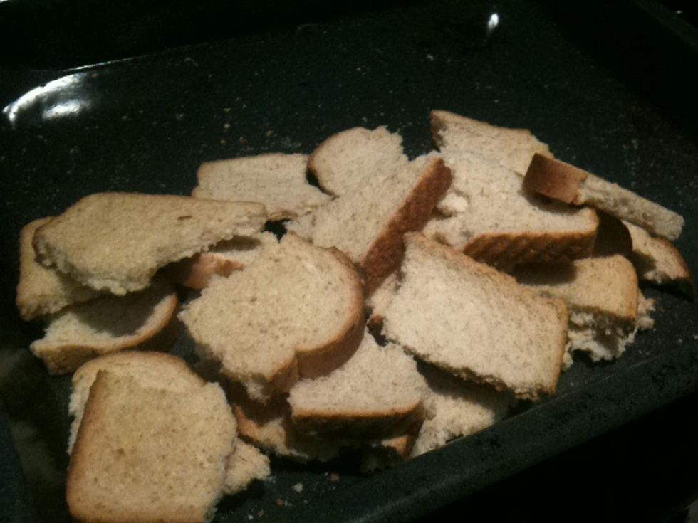 Tear the bread slices into smaller pieces.