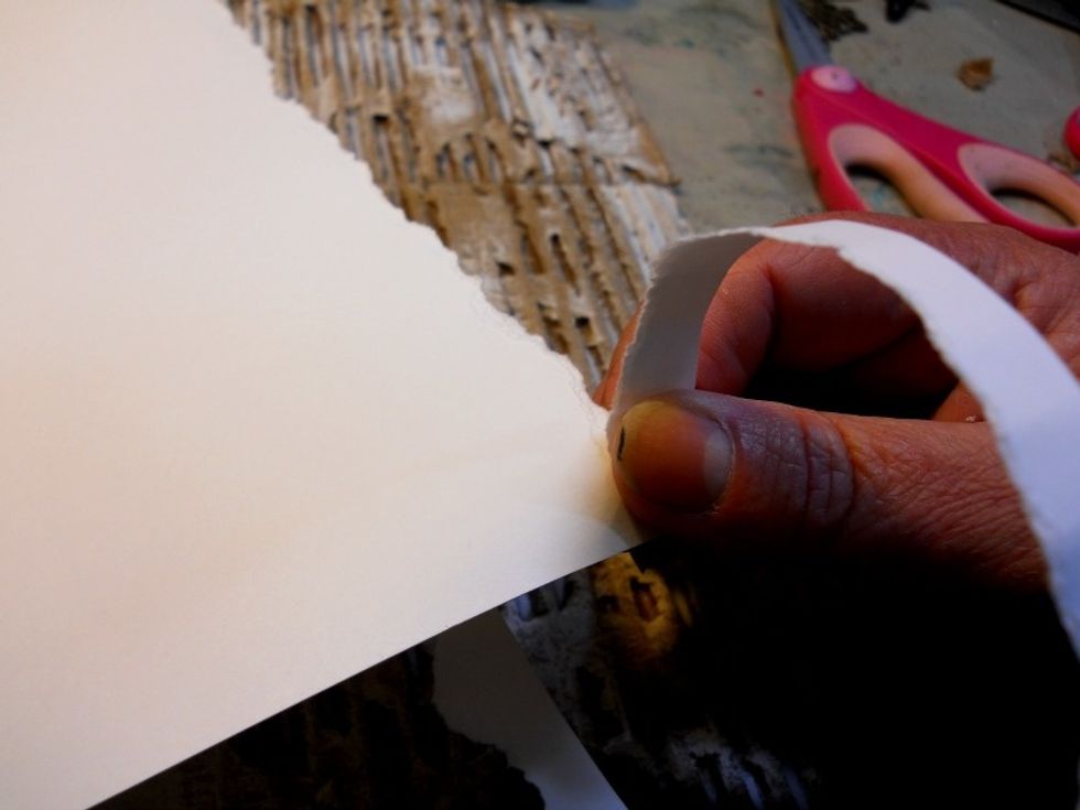 Tear the edges of a piece of smooth white cardstock till the piece is approx. 10"x10".