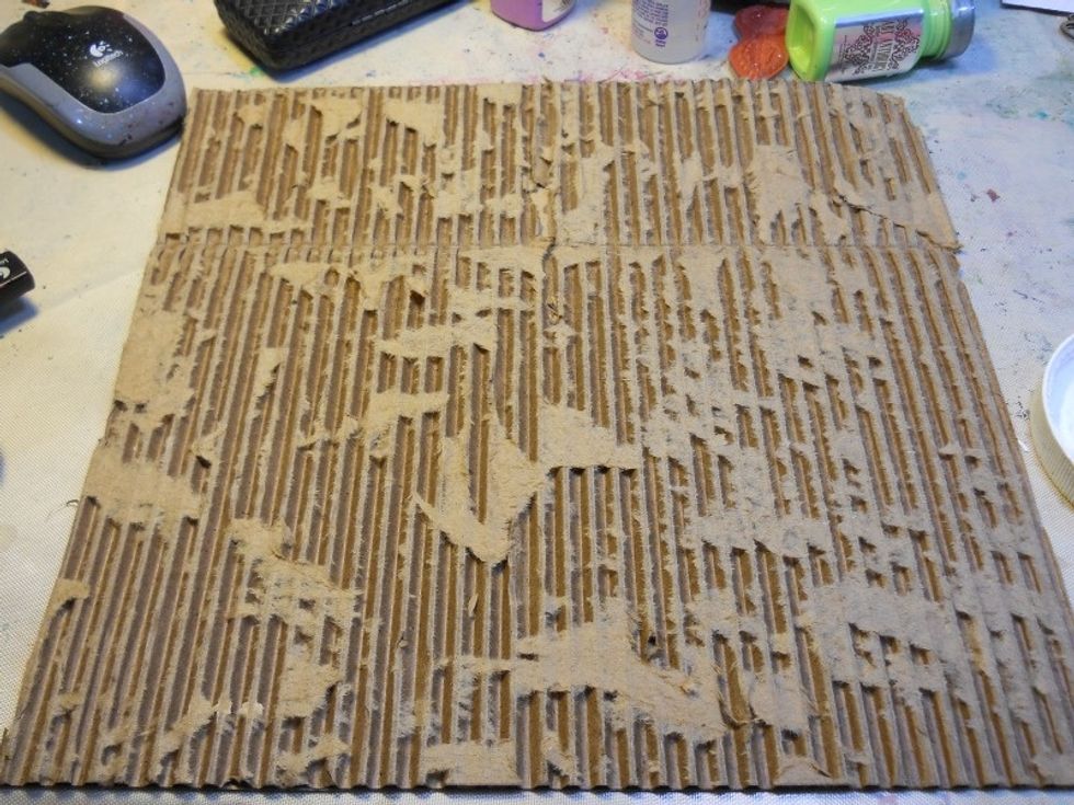 Tear the front piece of paper off of a piece of corrugated cardboard that has been cut to 12"x12".