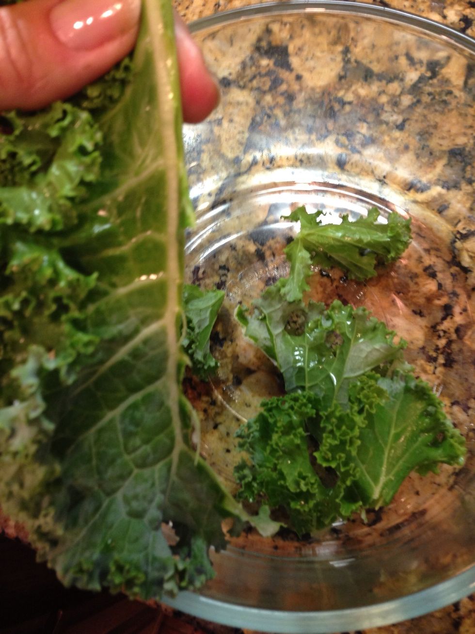 Tear the leaves from the stems and place in a bowl.