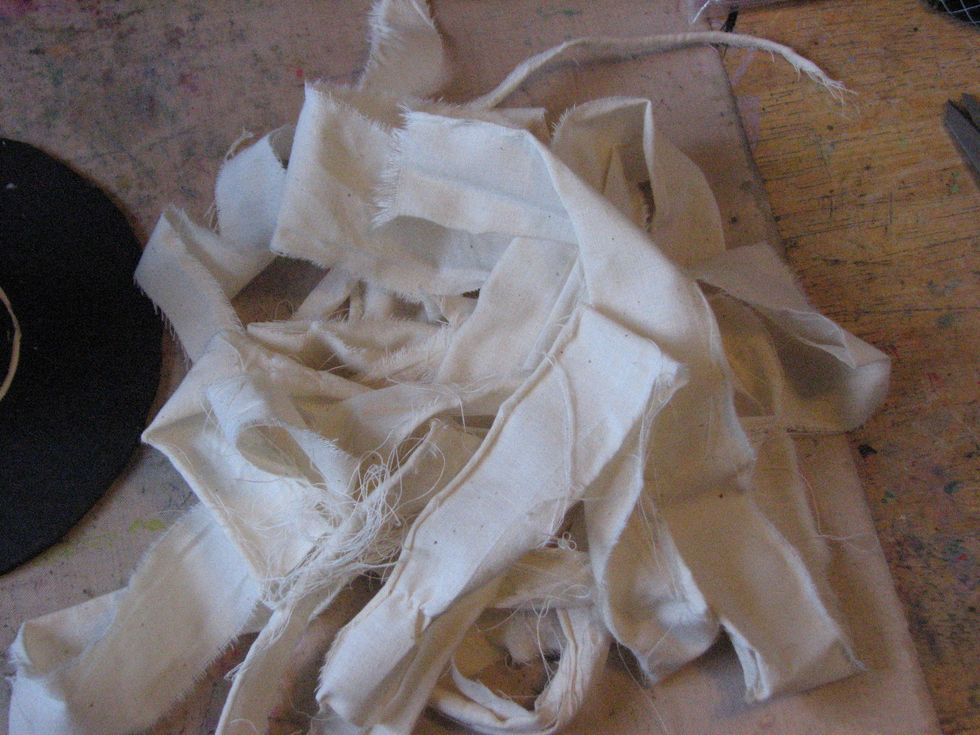 Tear the muslin in 1" - 2" wide strips.  Leave the edges frayed for a tattered look.