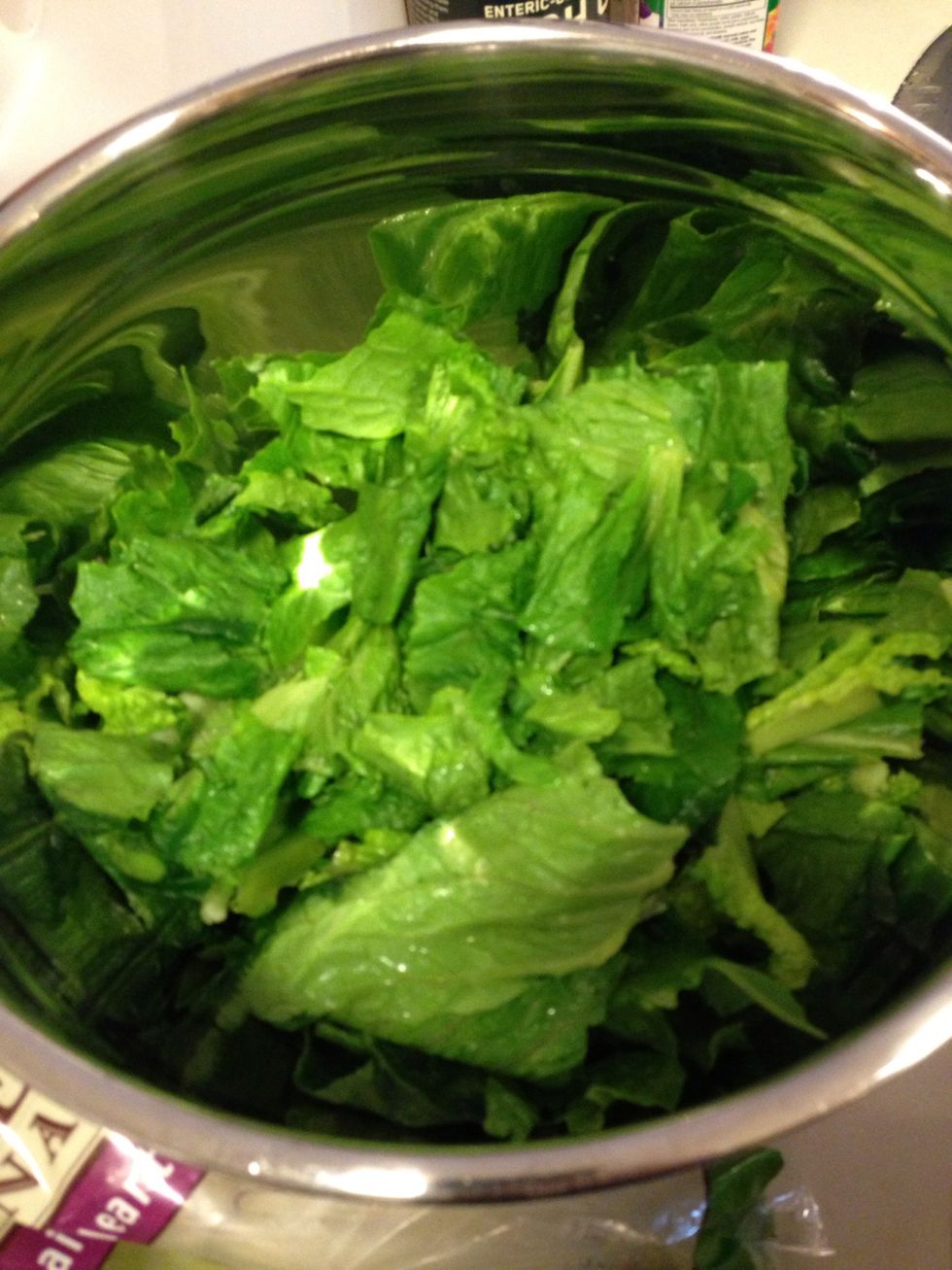 Tear the romaine into bite size pieces Nd add to a bowl