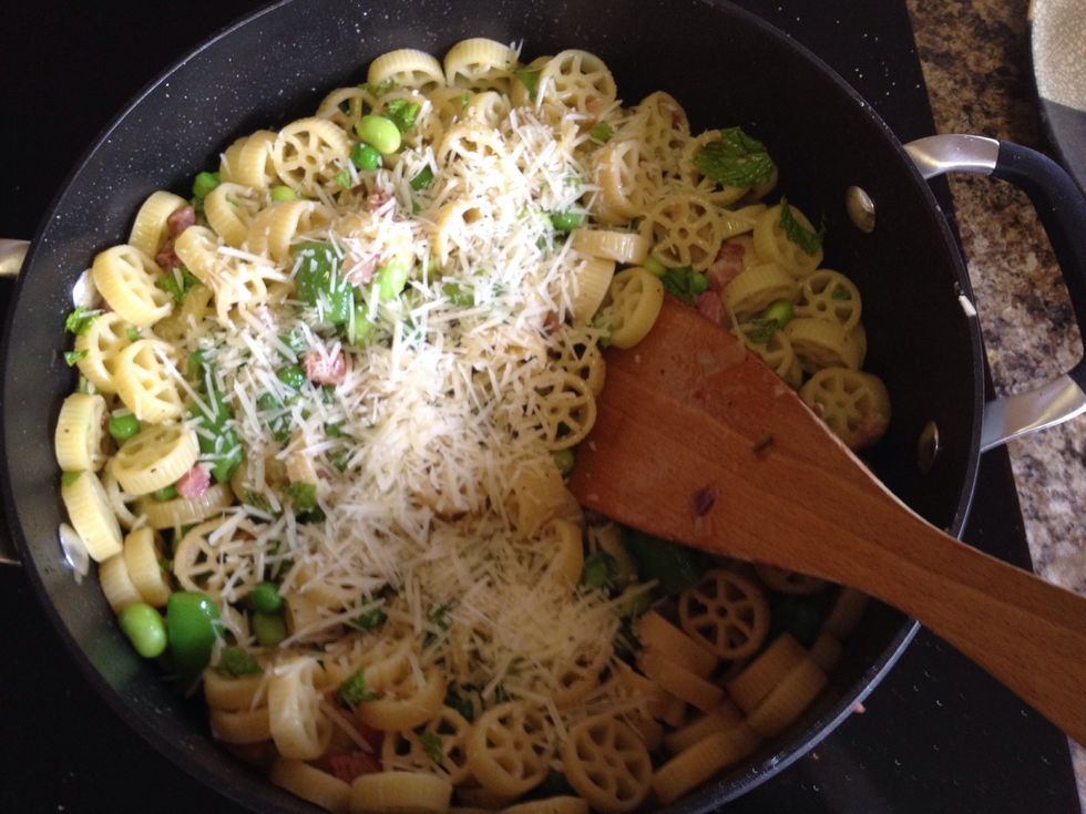Tear up some fresh mint and sprinkle with Parmesan cheese. Toss until everything is coated. Add pasta water, a tsp at a time, to create a light sauce.