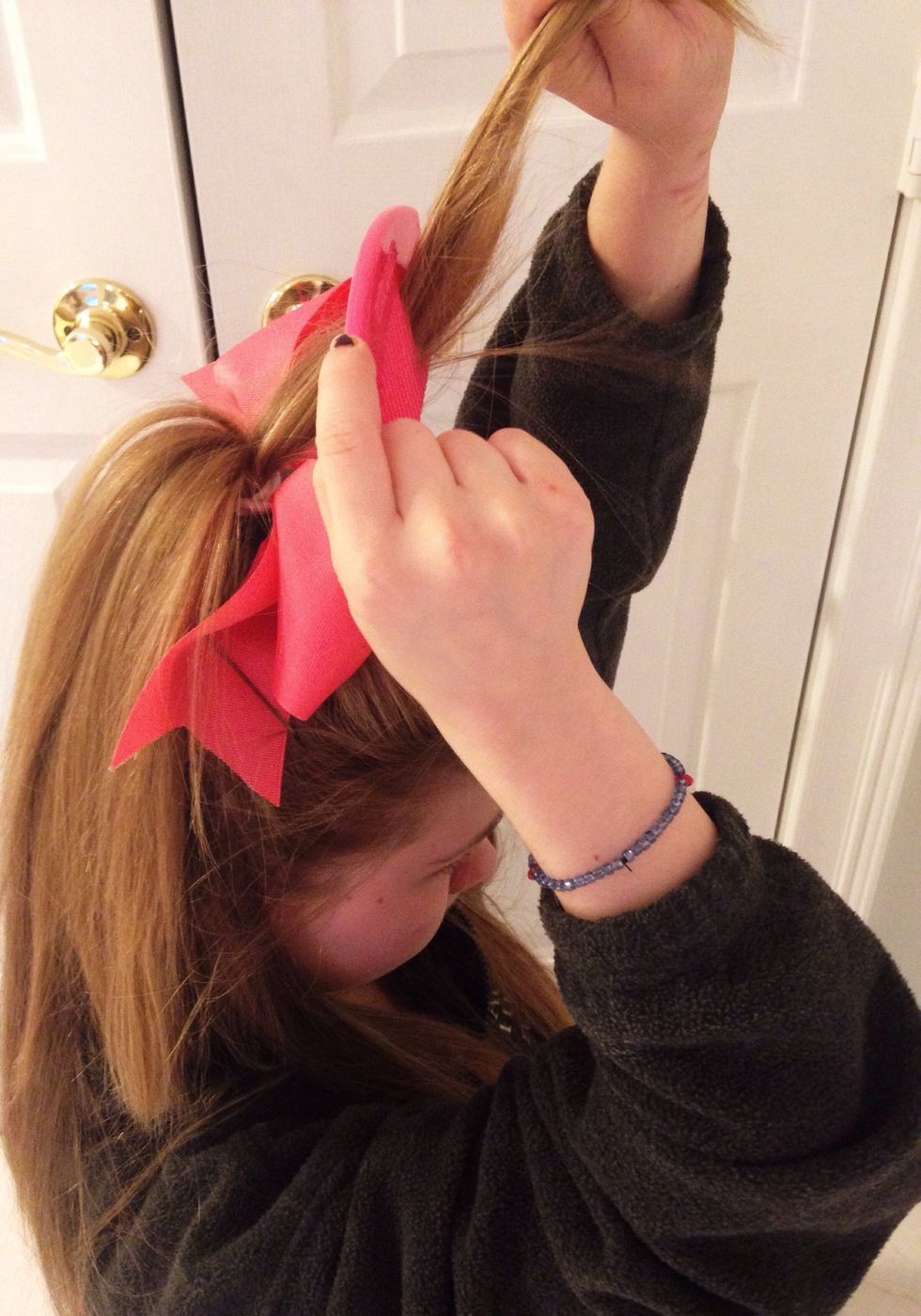 Tease the top of the ponytail, like you teased your poof in step 4.