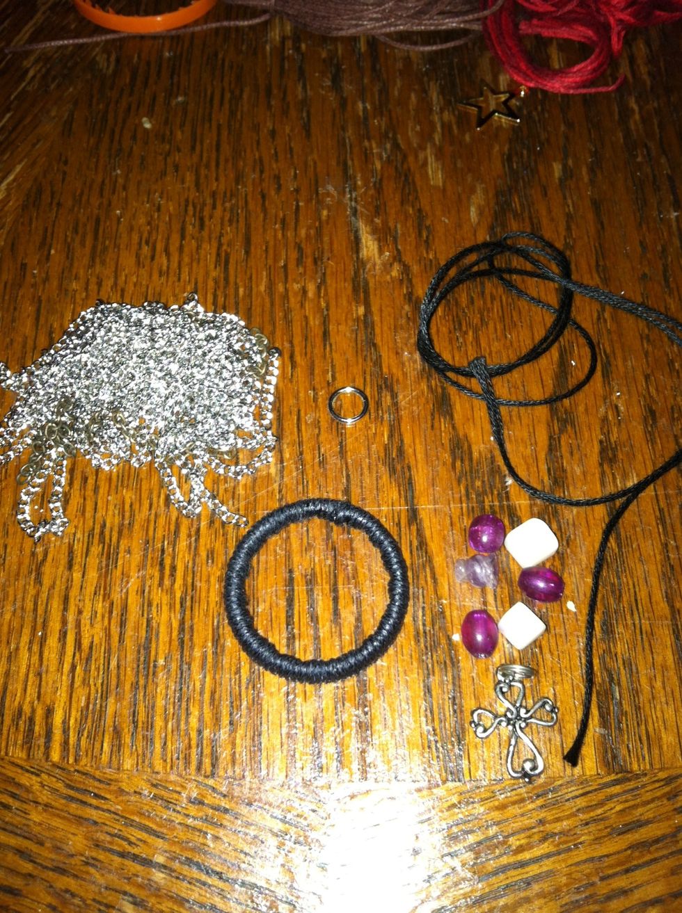 Technique 1: Adding to a pre-wrapped ring. I am going to make a center piece and two asymmetrical hanging sides. I'm also going to attach it to a chain.