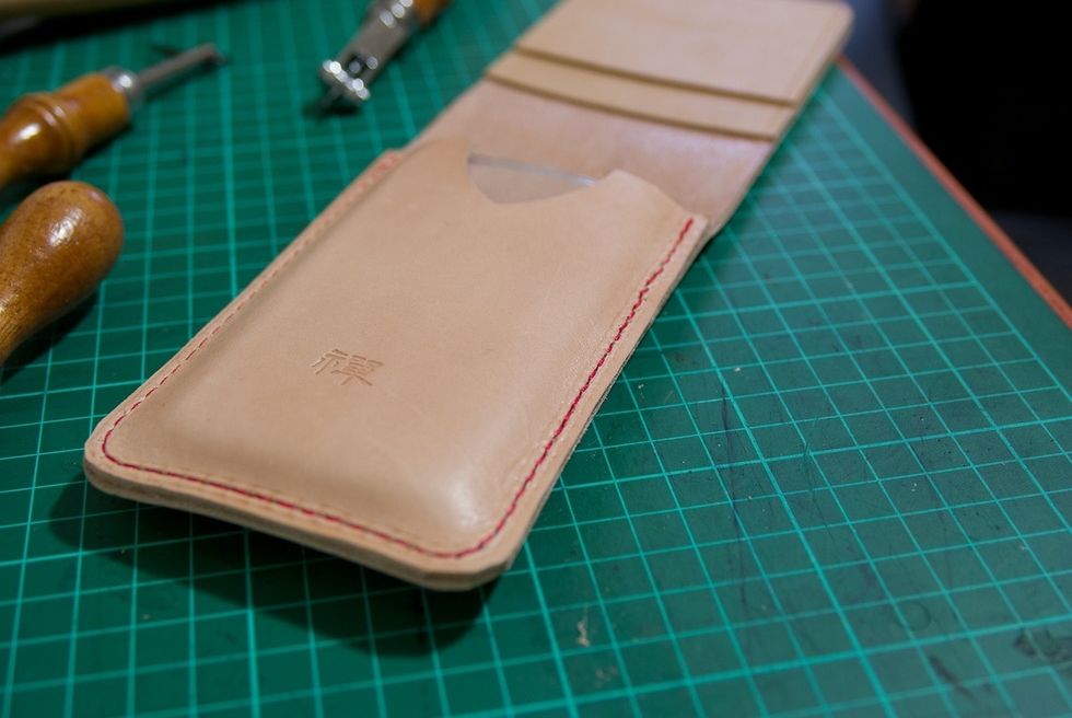 Test fitting (you could use moisture to case the leather and harden it in the shape of the phone).