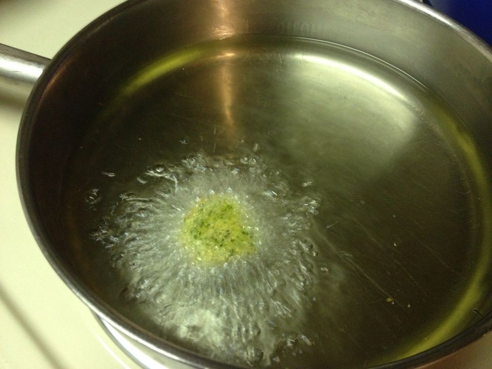 Test one to determine if you have the  right oil temp.  You want to shoot for 2-3 minutes of frying time a side, leaving  a golden brown crispy shell. Too quick it'll burn before the inside is fluffy.