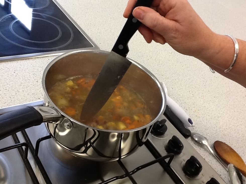 Test the potatoes to show when they are soft.